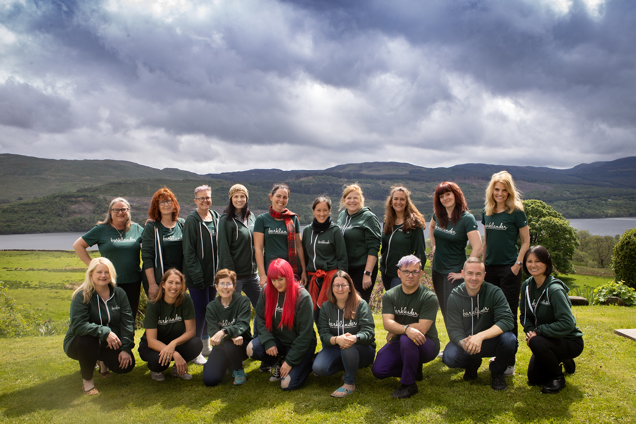 group of people wearing green outside