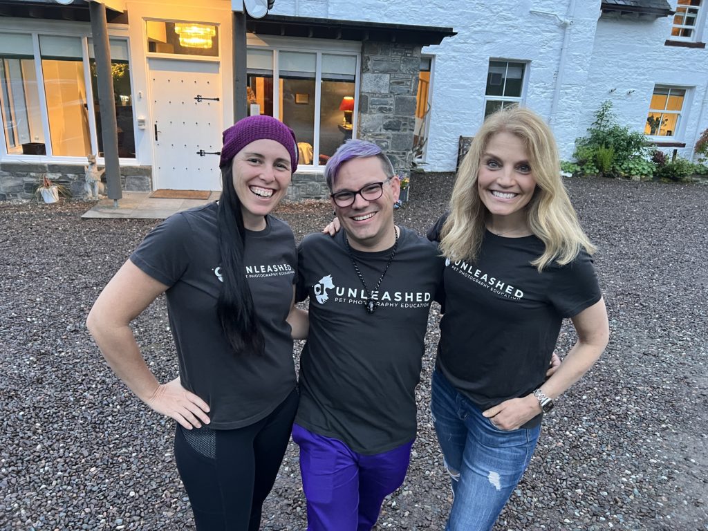 three people smiling wearing green