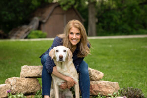 woman with old yellow lab