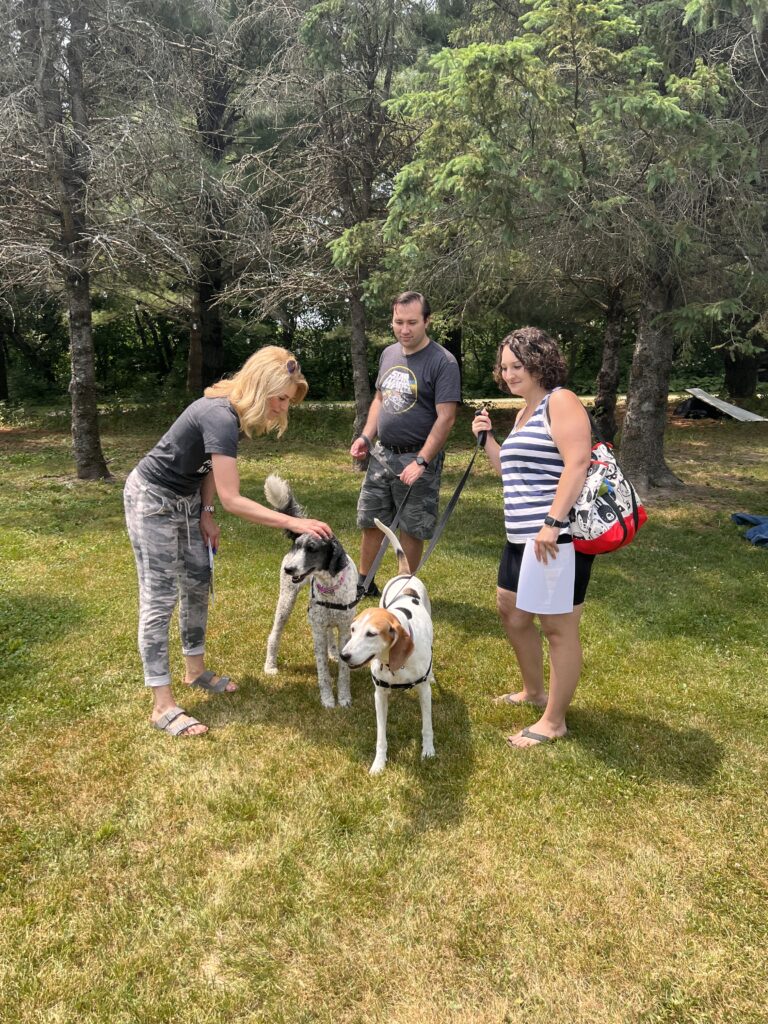 a group of people and a dog outside